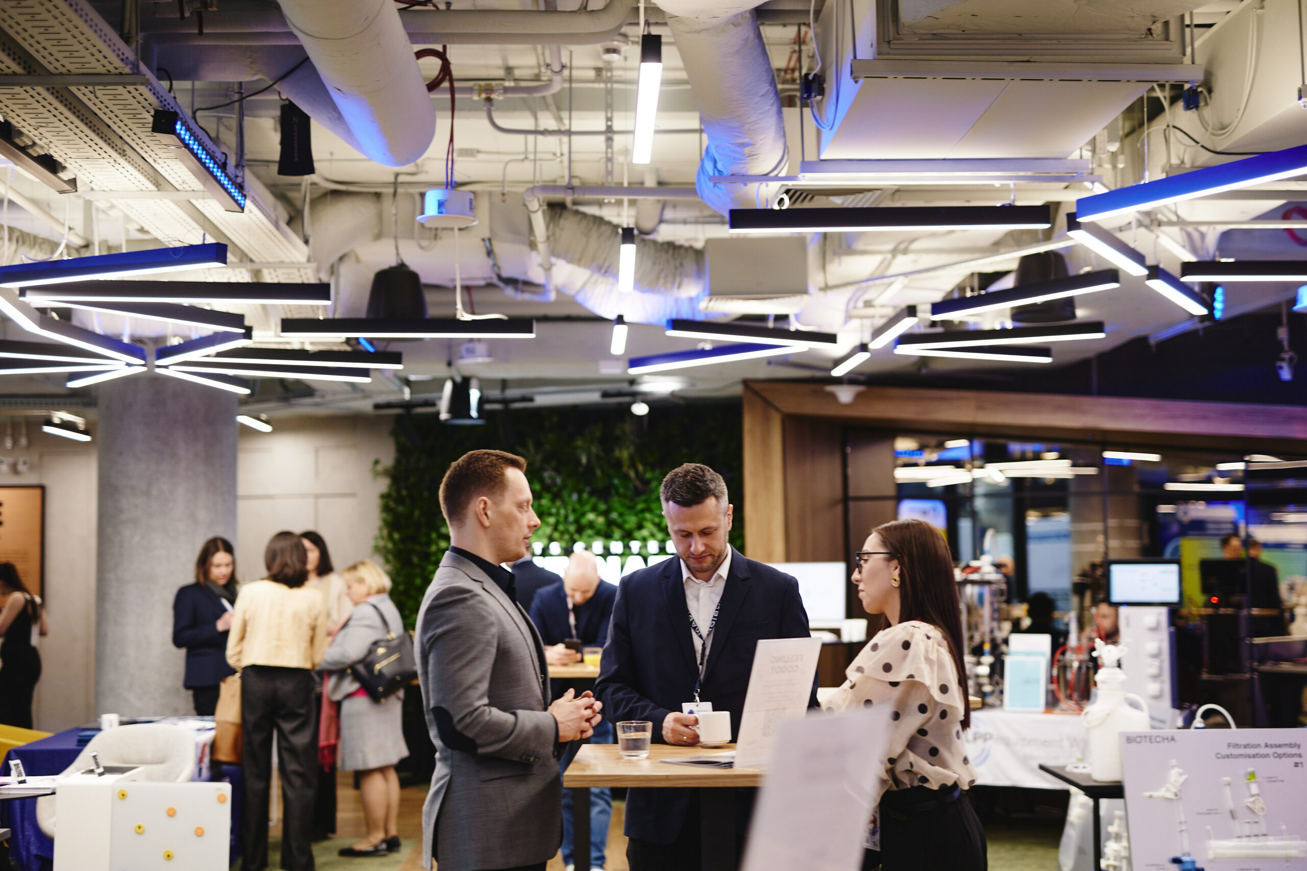Meetings with potential biopharma clients in the forum foyer.